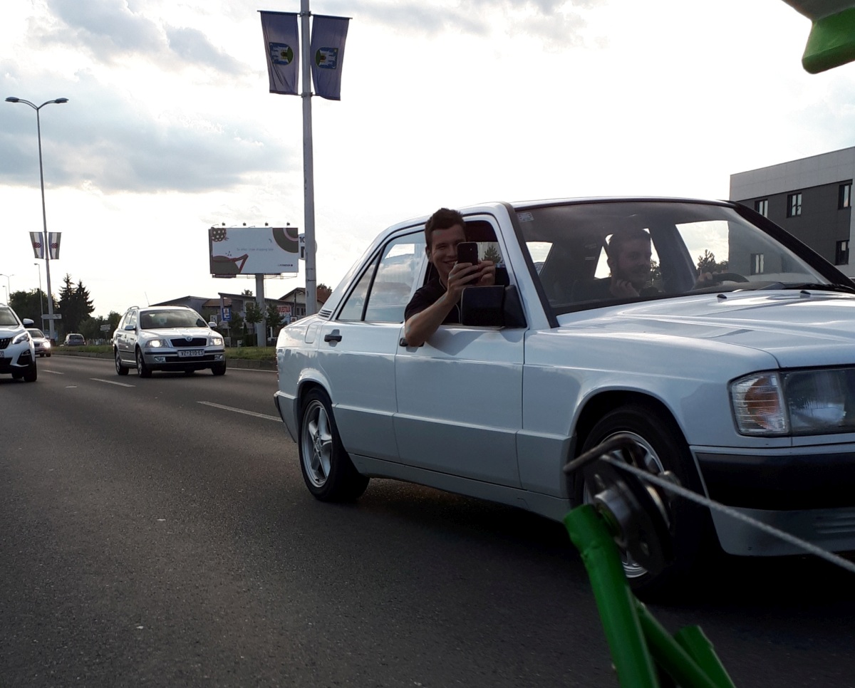 Regular occurance of people in cars taking pictures and videos while passing us. Here at least it is the passenger and not the driver!